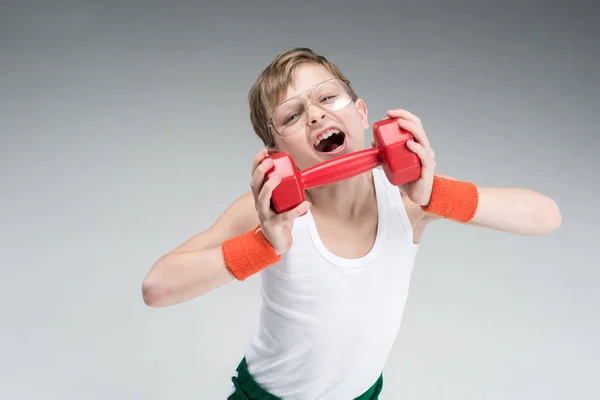 Active boy with dumbbell — Stock Photo