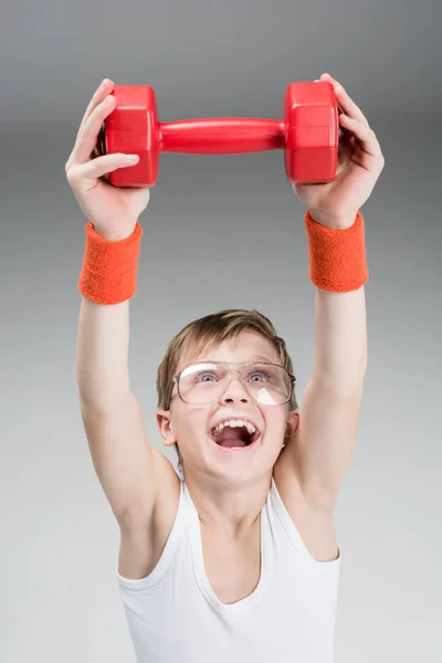 Active boy with dumbbell — Stock Photo