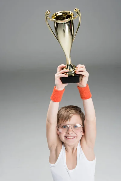 Active boy with champion's goblet — Stock Photo