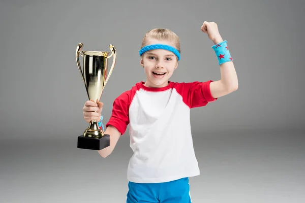 Active girl with champion's goblet — Stock Photo