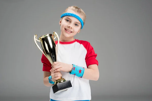 Active girl with champion's goblet — Stock Photo
