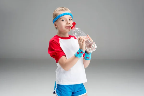 Little girl drinking water — Stock Photo