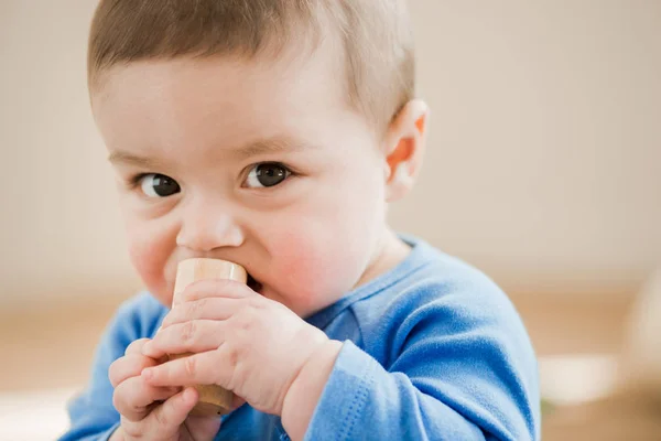 Adorable child with wooden toy — Stock Photo