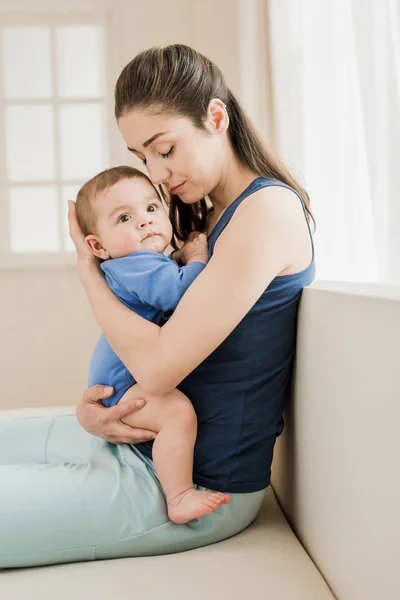 Mother hugging her son — Stock Photo