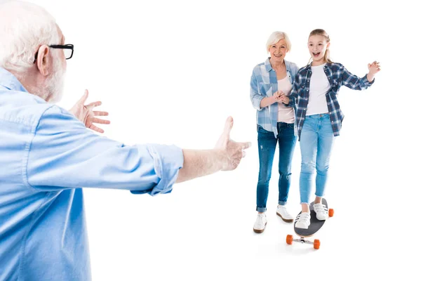 Happy granddaughter with skateboard — Stock Photo