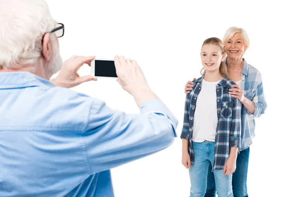 Grandfather taking photo on smartphone — Stock Photo