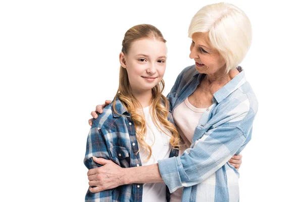 Grandmother and granddaughter hugging — Stock Photo