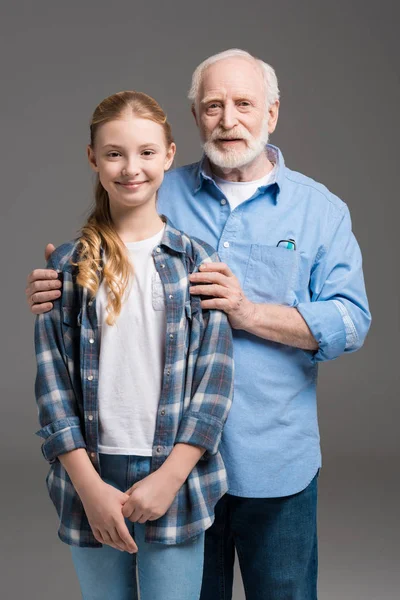 Grandfather and granddaughter hugging — Stock Photo