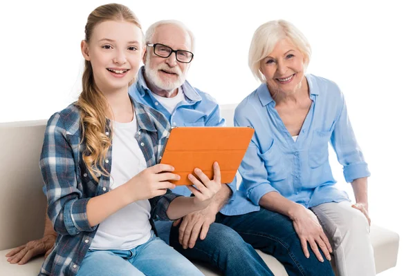 Family using digital tablet — Stock Photo