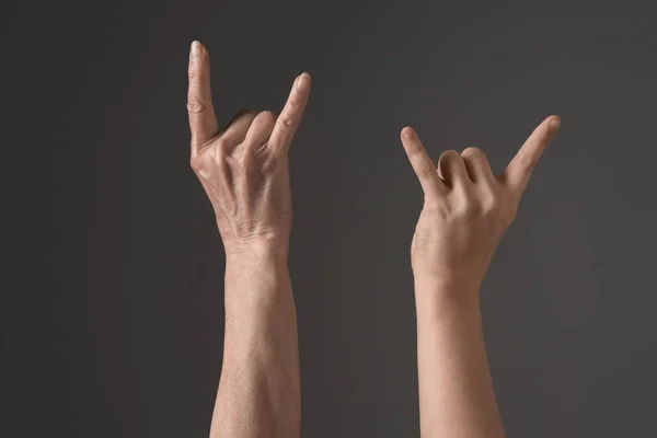 Hands with rock signs — Stock Photo