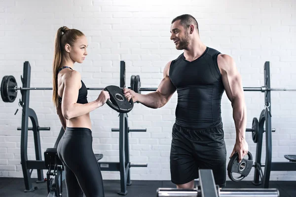 Man and woman in gym — Stock Photo