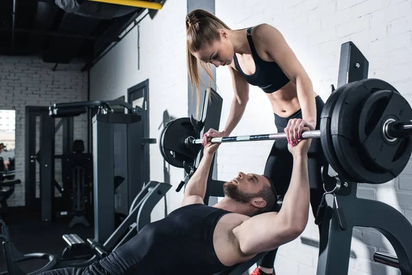 Man and woman in gym — Stock Photo