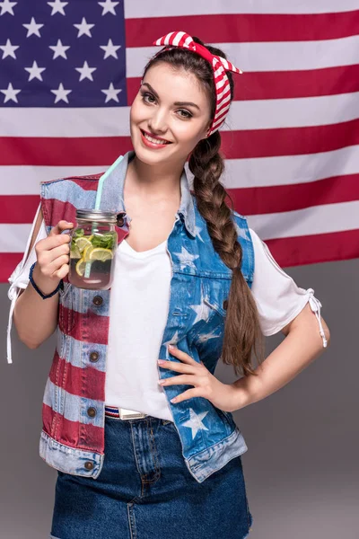 Woman holding drink — Stock Photo