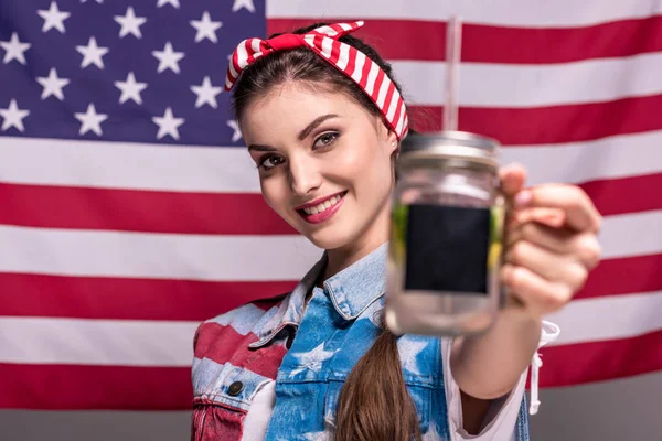 Woman showing drink in hand — Stock Photo