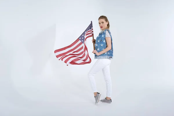 Young woman waving USA flag — Stock Photo