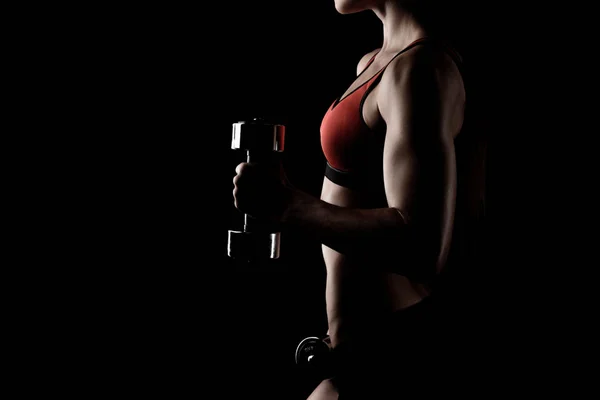 Sportswoman training with dumbbells — Stock Photo