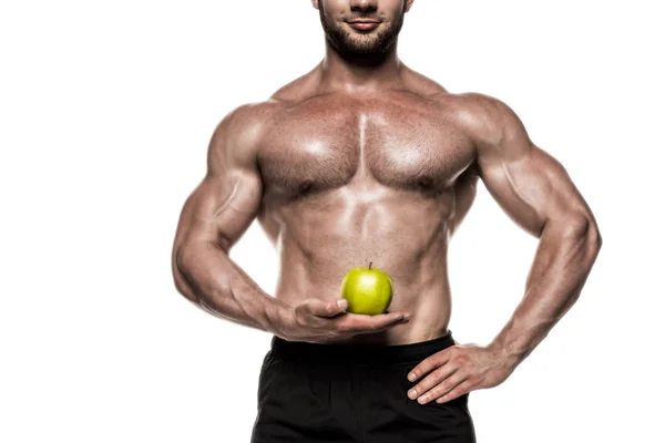 Muscular sportsman holding apple 4 — Stock Photo