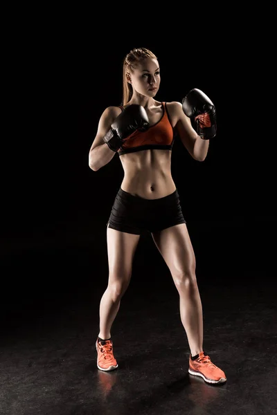 Sportswoman in boxing gloves — Stock Photo