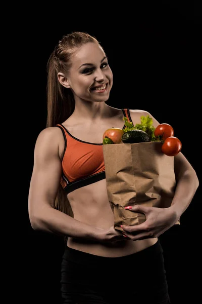 Woman holding bag with vegetables — Stock Photo