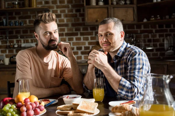 Gay couple having breakfast — Stock Photo