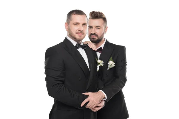 Couple of grooms embracing and looking at camera — Stock Photo