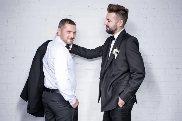 Couple of grooms in tuxedos — Stock Photo