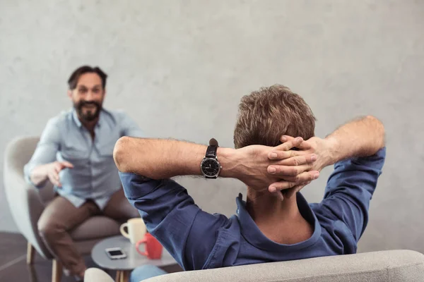 Casual mature businessmen talking at break — Stock Photo