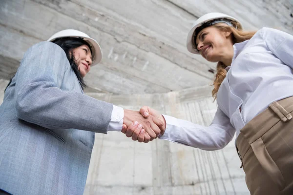 Architects shaking hands — Stock Photo