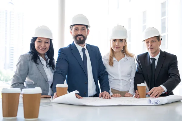 Smiling multiethnic architects in formal wear — Stock Photo