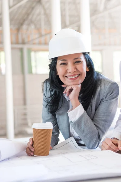 Asian contractor holding coffee cup — Stock Photo