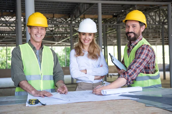 Middle aged constructors and contractor — Stock Photo