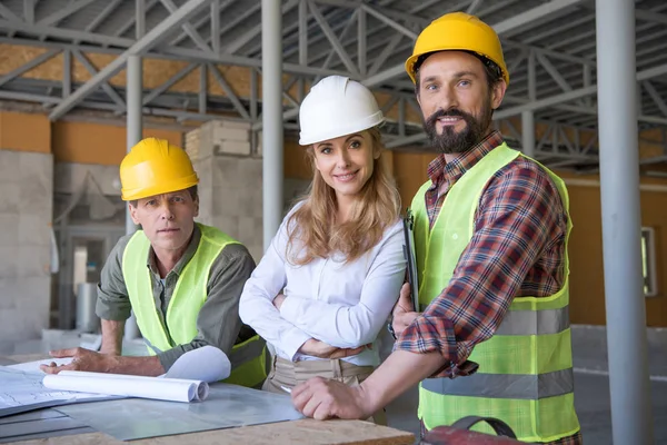 Middle aged constructors and contractor — Stock Photo