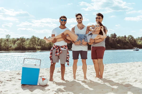 Friends spending time on beach — Stock Photo