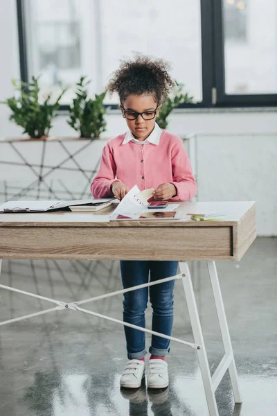 Cute little girl with scissors — Stock Photo