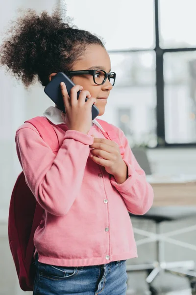 Cute little girl with smartphone — Stock Photo