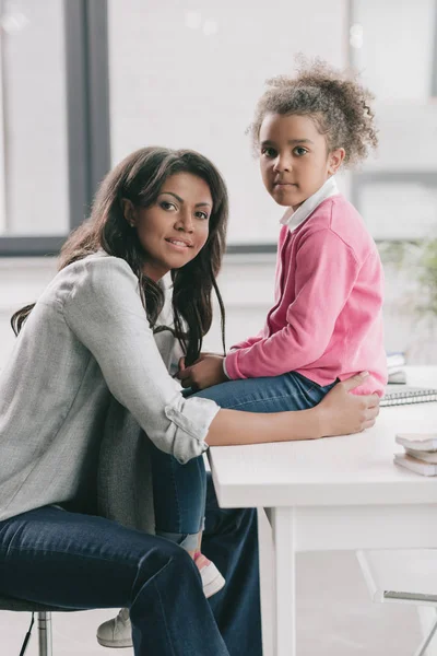 African american mother ambracing daughter — Stock Photo