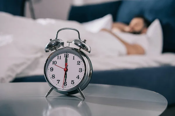 Alarm clock in bedroom — Stock Photo