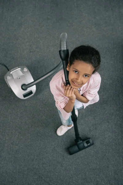 Little girl cleaning at home — Stock Photo