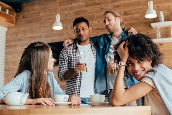 Multiethnic people in cafe — Stock Photo