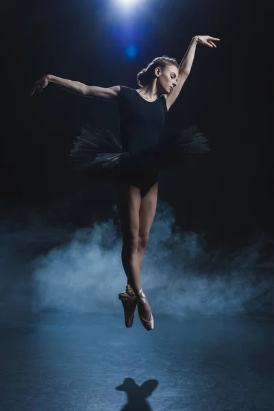 Ballerina dancing in black tutu — Stock Photo