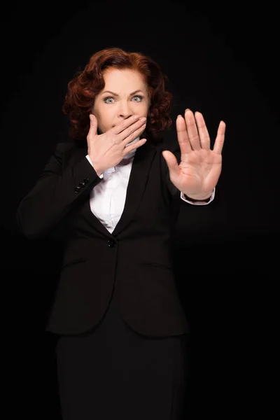 Businesswoman covering mouth — Stock Photo