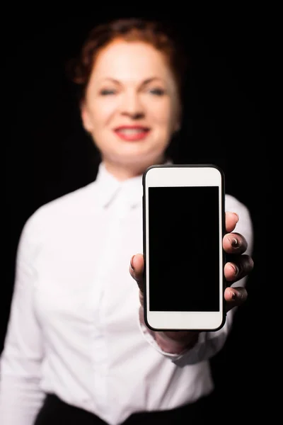 Woman showing smartphone screen — Stock Photo