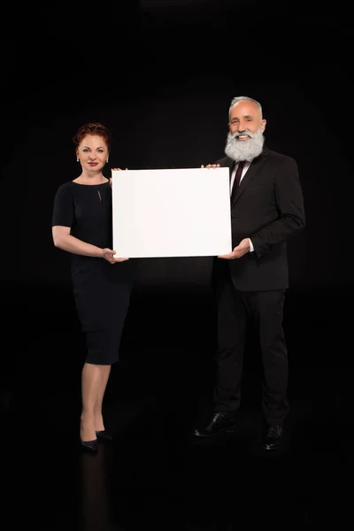 Woman and man holding blank card — Stock Photo