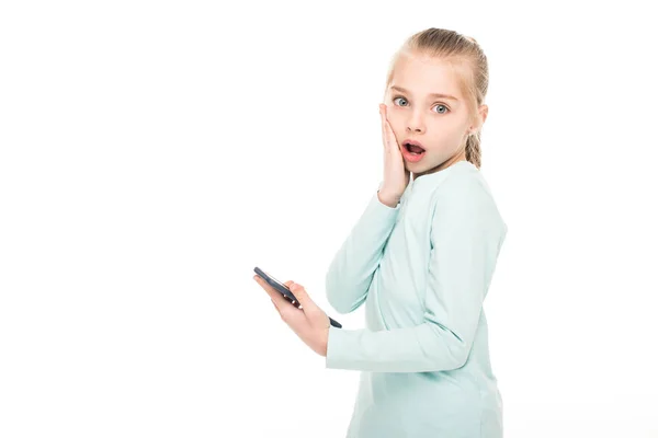 Shocked child with smartphone — Stock Photo