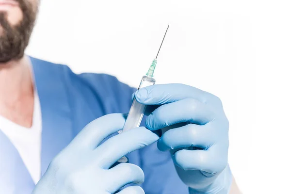 Doctor holding syringe — Stock Photo