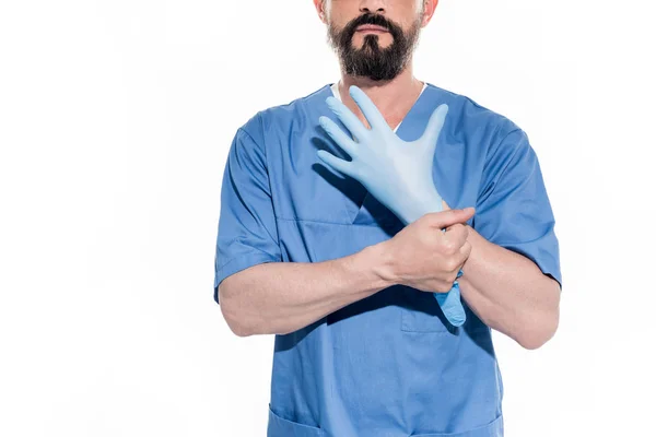 Bearded doctor wearing glove — Stock Photo