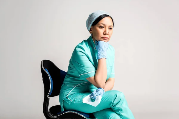 Pensive asian doctor — Stock Photo