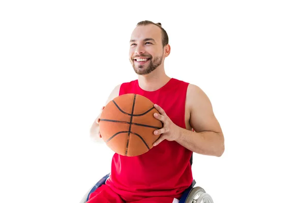 Sportsman in wheelchair throwing ball — Stock Photo