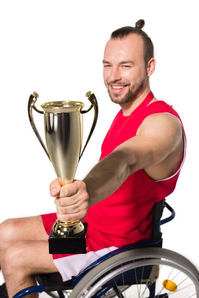 Sportsman in wheelchair with trophy — Stock Photo