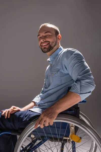 Smiling man in wheelchair — Stock Photo